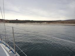 Looking North West. The train tracks are on the cliff above the beach.