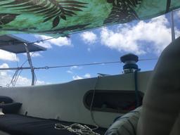 Rosie jury rigged a bimini with clothespins and a lavalava
