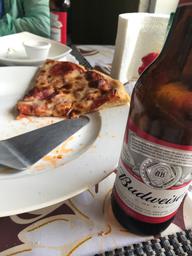 Paradise pizza and a cold beer.
